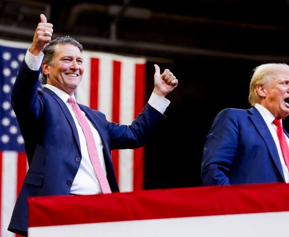 Rep. Ronny Jackson (R-Texas) is welcomed to the stage by Trump at a rally in 2024.
