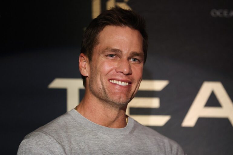 Tom Brady smiling at the Team Brady Leaders' Summit.