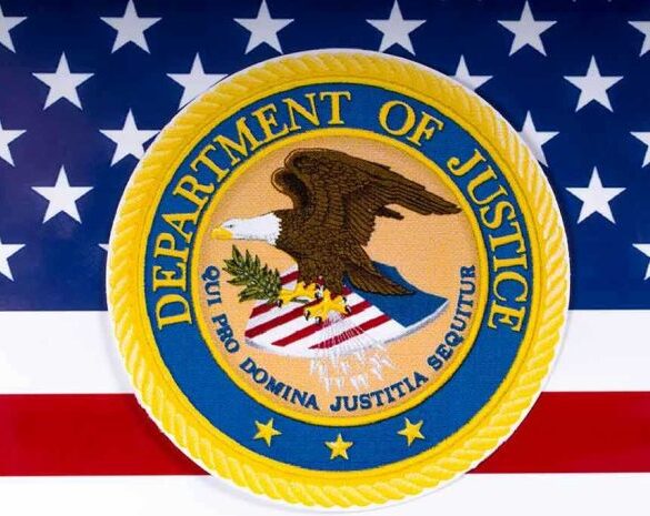 Department of Justice seal on American flag background.
