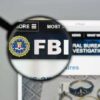 FBI website shown through magnifying glass.