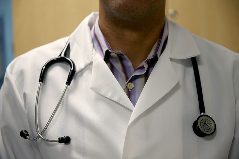 MIAMI, FL - JUNE 02: A doctor wears a stethoscope as he see a patient for a measles vaccination during a visit to the Miami Children's Hospital on June 02, 2014 in Miami, Florida. The Centers for Disease Control and Prevention last week announced that in the United States they are seeing the most measles cases in 20 years as they warned clinicians, parents and others to watch for and get vaccinated against the potentially deadly virus. (Photo by Joe Raedle/Getty Images)