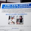 WASHINGTON, DC - NOVEMBER 19: A FBI Ten Most Wanted Fugitive poster is displayed during a news conference announcing the indictment of a former Olympic snowboarder Ryan Wedding, charging him with murder and money laundering in connection to a drug trafficking organization at the Justice Department on November 19, 2025 in Washington, DC. The Justice Department announced a fifteen-million-dollar reward for information leading to the arrest of Ryan James Wedding, the leader of a criminal drug organization who smuggled large quantities of cocaine through Colombia and Mexico for distribution in the United States and Canada. (Photo by Andrew Harnik/Getty Images)