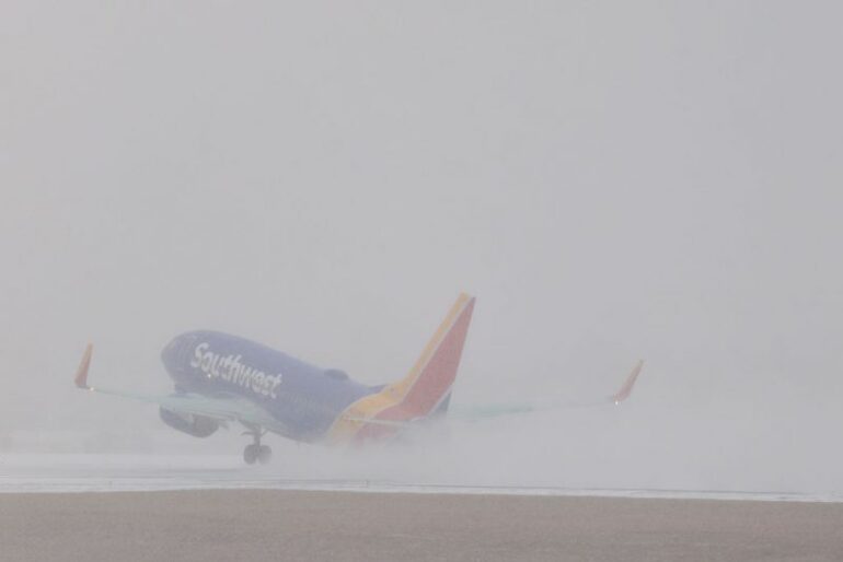 NASHVILLE, TENNESSEE - JANUARY 24: A southwest flight takes off at Nasvhille International Airport as snow falls on January 24, 2026 in Nashville, Tennessee. A massive winter storm is expected to bring frigid temperatures, ice, and snow to millions of Americans across the nation. (Photo by Brett Carlsen/Getty Images)