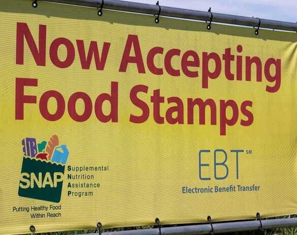 Yellow sign now accepting food stamps EBT SNAP