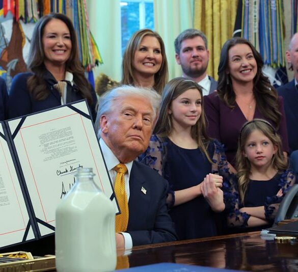 WASHINGTON, DC - JANUARY 14: U.S. President Donald Trump displays a signed bill during an event with dairy farmers in the Oval Office of the White House on January 14, 2026 in Washington, DC. Trump signed a series of bills including the "Whole Milk for Healthy Kids Act" to allow the sale of whole milk in school cafeterias across the country. (Photo by Anna Moneymaker/Getty Images)