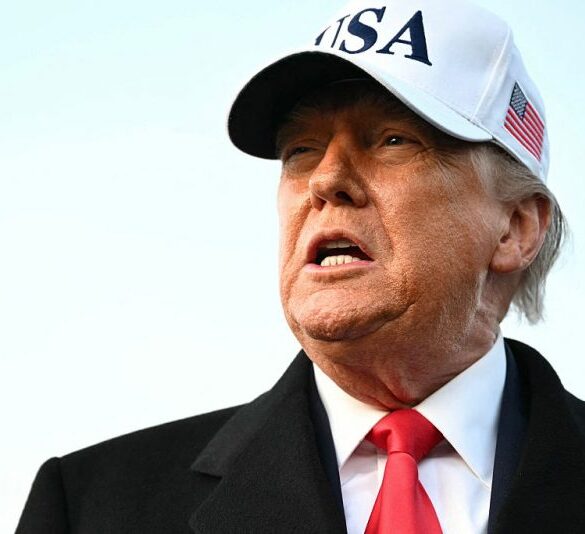 US President Donald Trump speaks to the press upon returning to Joint Base Andrews in Maryland on January 13, 2026. Trump is returning from speaking to The Detroit Economic Club in Detroit, Michigan, and a visit to a Ford production plant. (Photo by Mandel NGAN / AFP via Getty Images)