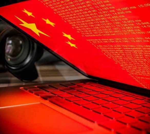 Laptop screen displaying Chinese flag and code.