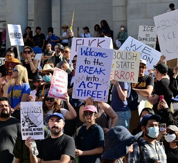 People partake in a "National Shutdown" protest against US Immigration and Customs Enforcement (ICE) in Los Angeles on January 30, 2026. Donald Trump's border chief said January 29, 2026 that some federal agents could be withdrawn from Minneapolis, the northern US city that has become the flashpoint for the president's immigration crackdown. The Trump administration, facing a public backlash over the shooting deaths of two Americans by federal agents in Minneapolis, also eased immigration operations in the northeastern state of Maine. (Photo by Frederic J. Brown / AFP via Getty Images)