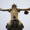 LONDON, ENGLAND - JANUARY 19: A statue of the Scales of Justice stands above the Old Bailey on January 19, 2021 in London, England. Criminal watchdogs representing England and Wales have expressed concern over the backlog of cases, caused by the Coronavirus pandemic. Figures have revealed that the backlog of unheard cases in the crown courts has reached 54,000. (Photo by Dan Kitwood/Getty Images)