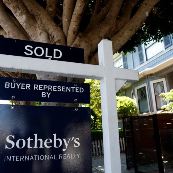 A "SOLD" sign from Sotheby's International Realty in front of a home.