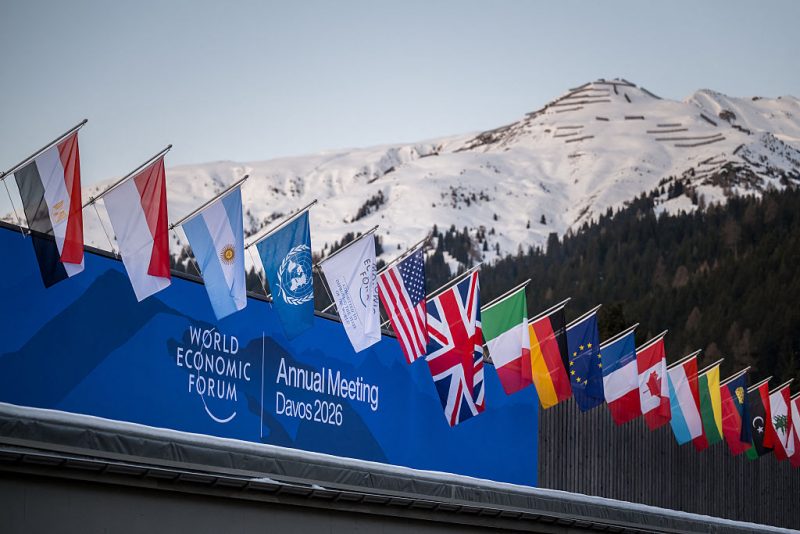 EDITORS NOTE: Graphic content / A sign of the World Economic Forum (WEF) is seen on the top of the Congress Centre that hosts the WEF annual meeting in the Alpine resort of Davos on its opening day in Davos on January 19, 2026. The World Economic Forum takes place in Davos from January 19 to January 23, 2026. (Photo by Fabrice COFFRINI / AFP via Getty Images)