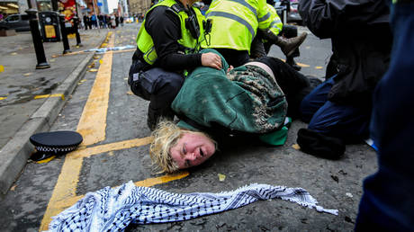 FILE PHOTO. A Palestine Action activist is arrested by police officers in Manchester, UK, November 22, 2023.
