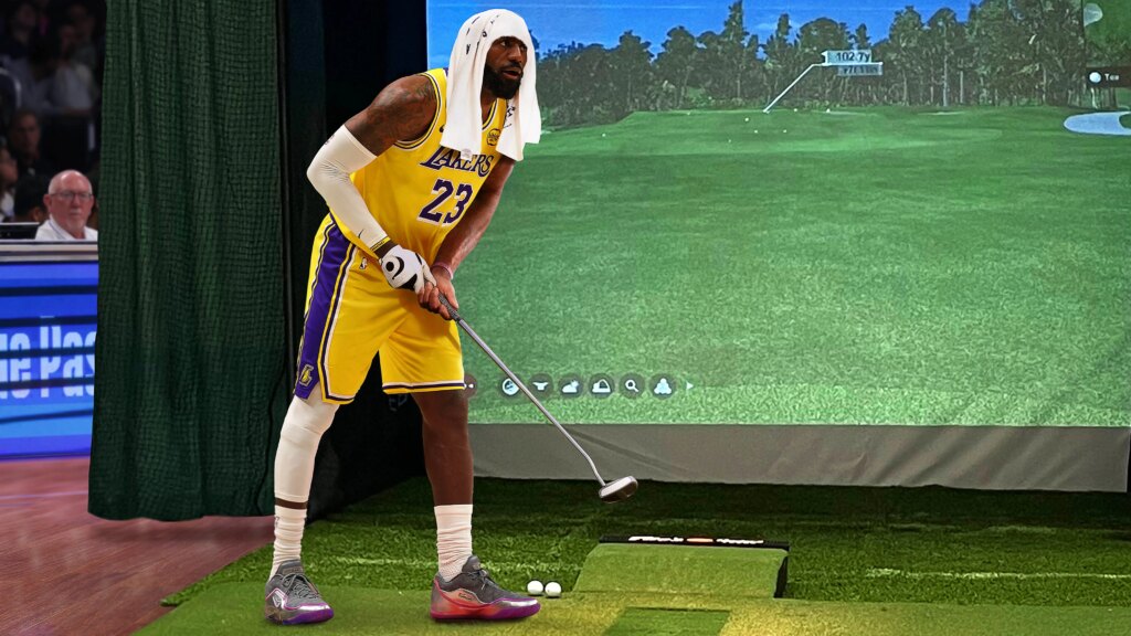 SATIRE NEWS: LeBron James Clearly Using Golf Simulator On Bench