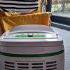 Meaco 12L Low Energy Dehumidifier in front of a rack of drying clothes