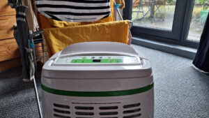 Meaco 12L Low Energy Dehumidifier in front of a rack of drying clothes