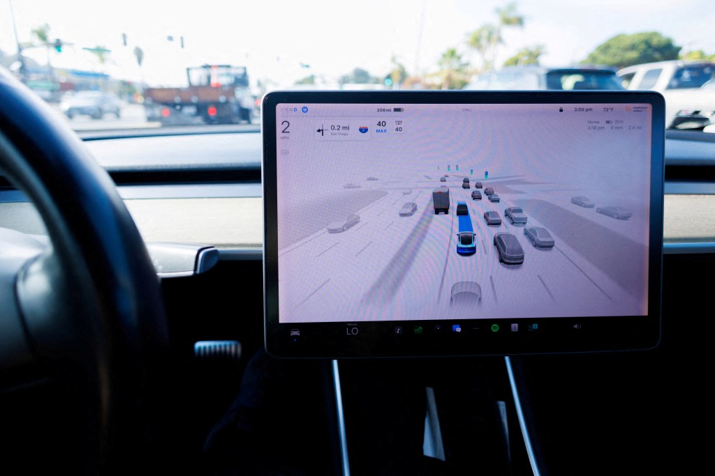 A Tesla Model 3's in-car display showing an illustration of the car self-driving on a road with other vehicles.