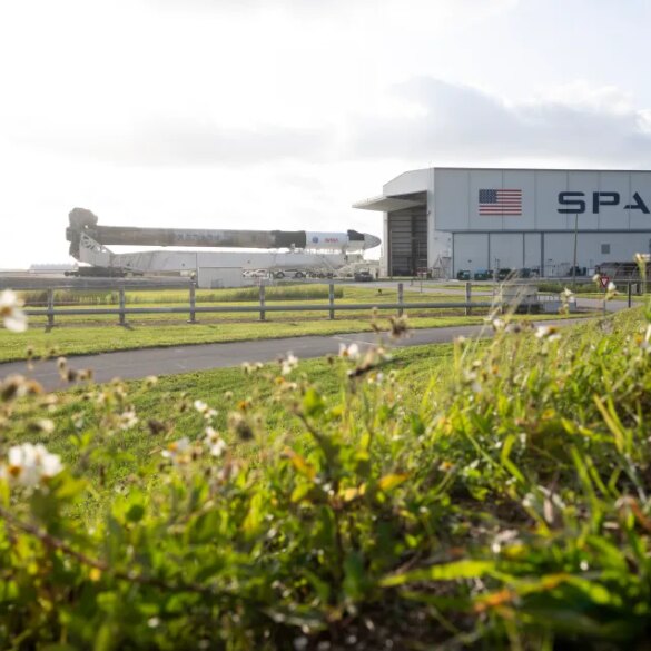 SpaceX Falcon 9 rocket and Crew Dragon spacecraft being rolled out to Launch Complex 39A.