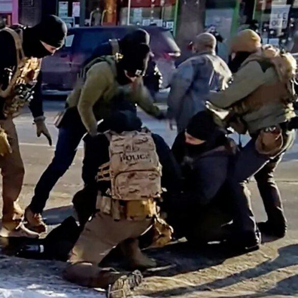 The moment that the first shot is fired, as heard on the video sound file, after an agent (in green) had already drawn his weapon while a man identified as Alex Pretti is being detained by federal officers, and after Pretti's gun was retrieved from a waistband holster by a federal officer (in light grey jacket) in Minneapolis, Minnesota, U.S., January 24, 2026 is seen in a still image of a video obtained by Reuters.