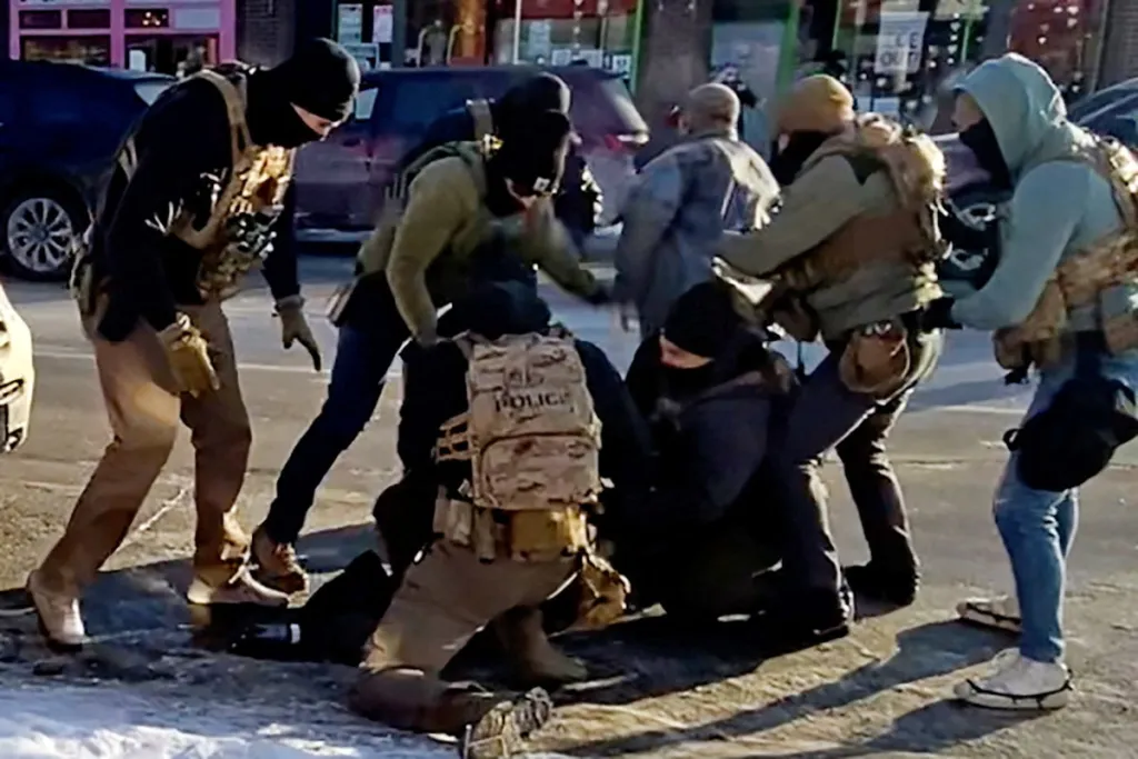 The moment that the first shot is fired, as heard on the video sound file, after an agent (in green) had already drawn his weapon while a man identified as Alex Pretti is being detained by federal officers, and after Pretti's gun was retrieved from a waistband holster by a federal officer (in light grey jacket) in Minneapolis, Minnesota, U.S., January 24, 2026 is seen in a still image of a video obtained by Reuters.