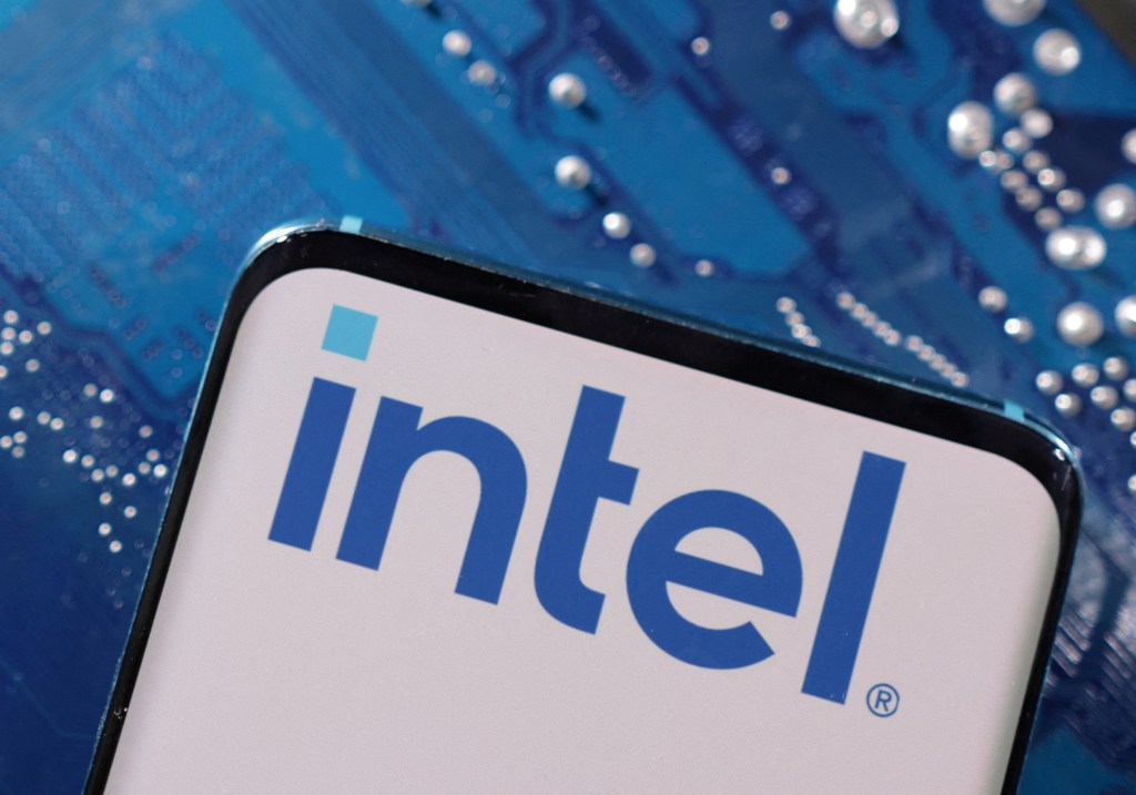 FILE PHOTO: A smartphone with an Intel logo displayed is placed on a computer motherboard in this illustration created on March 6, 2023. REUTERS/Dado Ruvic/Illustration/File Photo