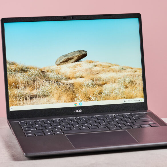 Acer Chromebook Plus 516 open on desk with pink background