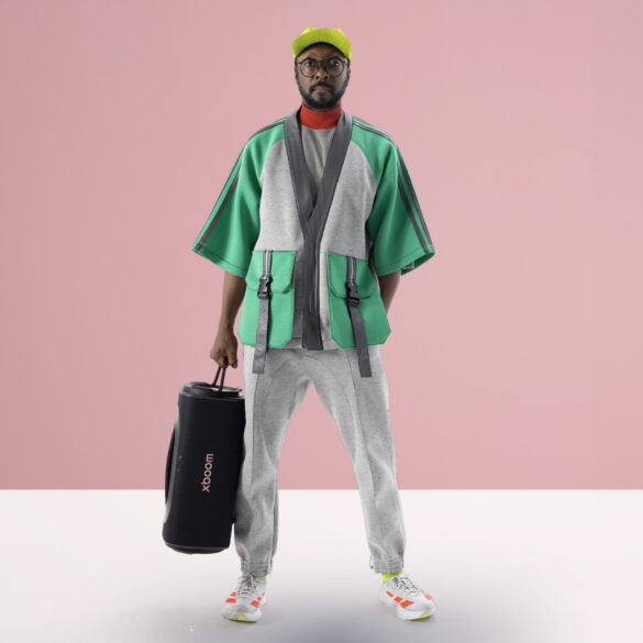 will.i.am holding an LG Stage 501 speaker