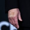 A bandage is seen on the hand of President Donald Trump while he walks the red carpet before the 48th Kennedy Center Honors on Dec. 7 at the John F. Kennedy Center for the Performing Arts in Washington.