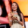 Michelle Yeoh holding her Honorary Golden Bear award.