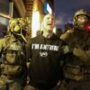 Federal agents with Homeland Security Investigations (HSI) detain a protestor wearing an "Antifa" shirt outside a residential building in Minneapolis, Minnesota, on February 5, 2026. US President Donald Trump suggested on February 4 that a "softer touch" may be needed on immigration, as his administration said 700 federal officers would be pulled from Minnesota but that mass deportations would not stop. The fatal shootings of two protesters by federal officers in Minneapolis last month sparked widespread outrage in the United States and calls for an end to immigration raids in the Midwestern city, but Trump's administration has been reluctant to shift course. (Photo by Charly TRIBALLEAU / AFP via Getty Images)