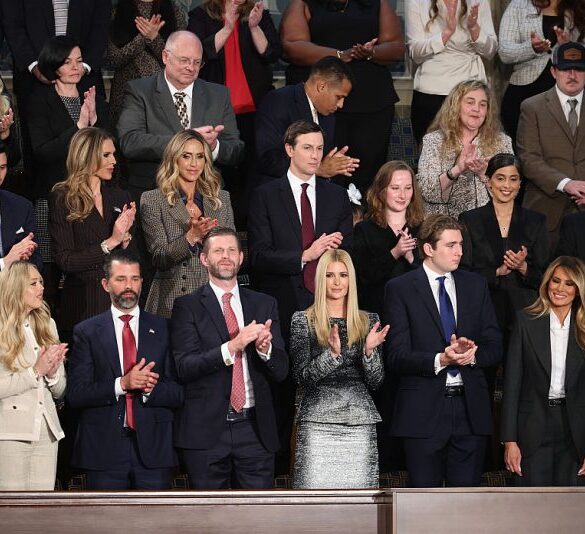 WASHINGTON, DC - FEBRUARY 24: Trump family members (top row (L-R) Bettina Anderson, LaraTrump Jared Kuschner and (bottom row L to R) Tiffany Trump, Donald Trump Jr, Eric Trump, Ivanka Trump, Barron Trump and First Lady Melania Trump applaud during the State of the Union address during a Joint Session of Congress at the U.S. Capitol on February 24, 2026, in Washington, DC. Trump delivered his address days after the Supreme Court struck down the administration's tariff strategy and amid a U.S. military buildup in the Persian Gulf threatening Iran. (Photo by Win McNamee/Getty Images)