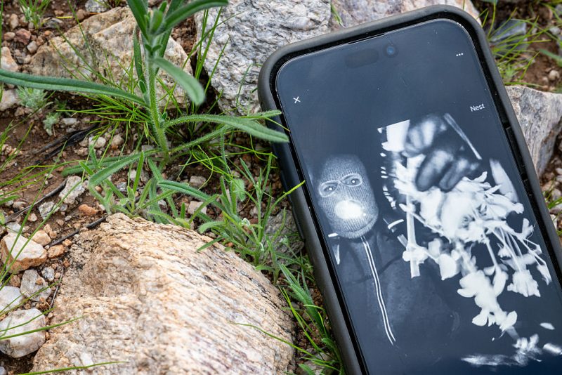 TUCSON, ARIZONA - FEBRUARY 10: In this photo illustration, Nancy Guthrie's alleged kidnapper is seen on FBI Director Kash Patel's X account on a cellular phone February 10, 2026 in Tucson, Arizona. Searches continues for Nancy Guthrie, the 84-year-old mother of U.S. journalist and television host Savannah Guthrie, after she went missing from her home on the morning of February 1st. Guthrie's possible abductors had set a deadline of 5pm on February 9 for a $6 million payment. (Photo by Brandon Bell/Getty Images)