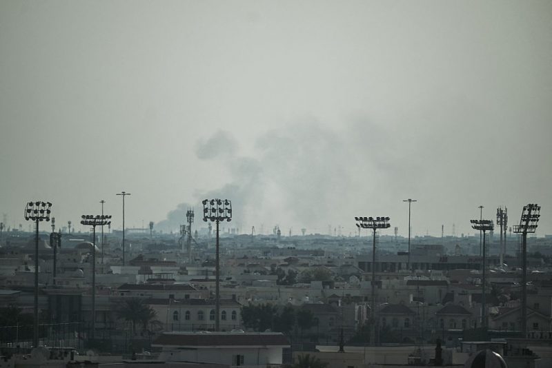 Smoke rises from an area in the direction of Al Udeid Air Base, which houses the Qatar Emiri Air Force and foreign forces including the US, in Doha on February 28, 2026, following a reported Iranian strike. The United States and Israel launched strikes against Iran on February 28, with Israel's public broadcaster reporting that supreme leader Ayatollah Ali Khamenei had been targeted, as the Islamic republic retaliated with barrages of missiles at Gulf states and Israel. (Photo by Mahmud HAMS / AFP via Getty Images)