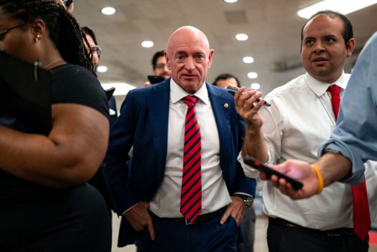 WASHINGTON, DC - JULY 25: U.S. Sen. Mark Kelly (D-AZ) speaks with reporters while waiting to catch the Senate subway to the Hart Senate Office Building from the U.S. Capitol on July 25, 2024 in Washington, DC. Multiple news outlets are reporting that the Senator from Arizona and former astronaut is one of many candidates being vetted to be the Vice Presidential running mate to Kamala Harris. (Photo by Kent Nishimura/Getty Images)