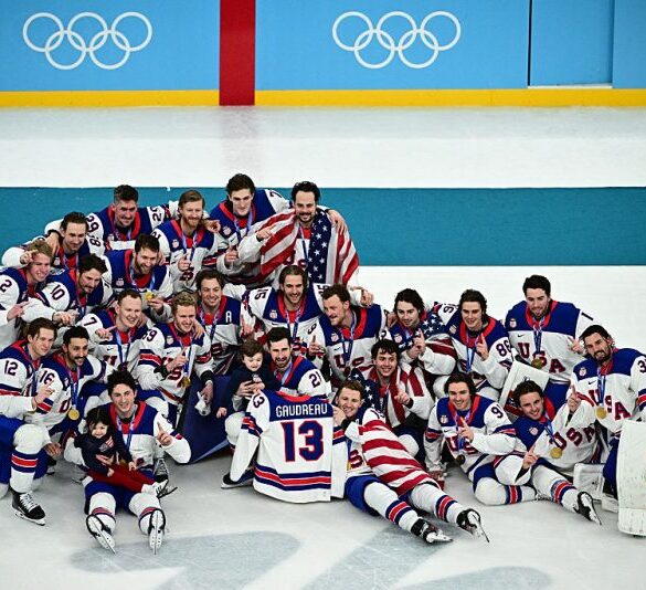 TOPSHOT - Gold medallists USA's players pose during the medals ceremony of the men's ice hockey event at the Milano Santagiulia Ice Hockey Arena during the Milano Cortina 2026 Winter Olympic Games in Milan, on February 22, 2026. (Photo by JULIEN DE ROSA / AFP via Getty Images)