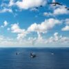 AT SEA- NOVEMBER 13: In this handout provided by the U.S. Navy, The U.S. Navy's Gerald R. Ford Carrier Strike Group, including the flagship USS Gerald R. Ford (CVN 78), front, USS Winston S. Churchill (DDG 81), right, USS Mahan (DDG 72), left, USS Bainbridge (DDG 96), and embarked Carrier Air Wing Eight F/A-18E/F Super Hornets assigned to Strike Fighter Squadrons 31, 37, 87, and 213, operates as a joint, multi-domain force with a U.S. Air Force B-52 Stratofortress, November 13, 2025. U.S. military forces, like the Gerald R. Ford Carrier Strike Group, are deployed in support of the U.S. Southern Command mission, Department of War-directed operations, and the President's priorities to disrupt illicit drug trafficking and protect the homeland. (Photo by Gladjimi Balisage/US Navy via Getty Images)