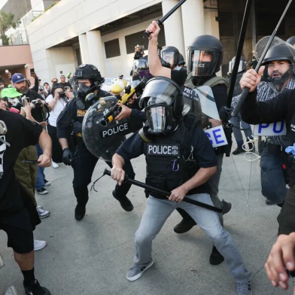 Protestors and police clashing during a "National Shutdown" protest against U.S. Immigration and Customs Enforcement.