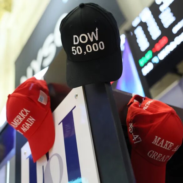 MAGA hats are hung on a wall as traders work on the floor of the New York Stock Exchange during morning trading on February 20th.