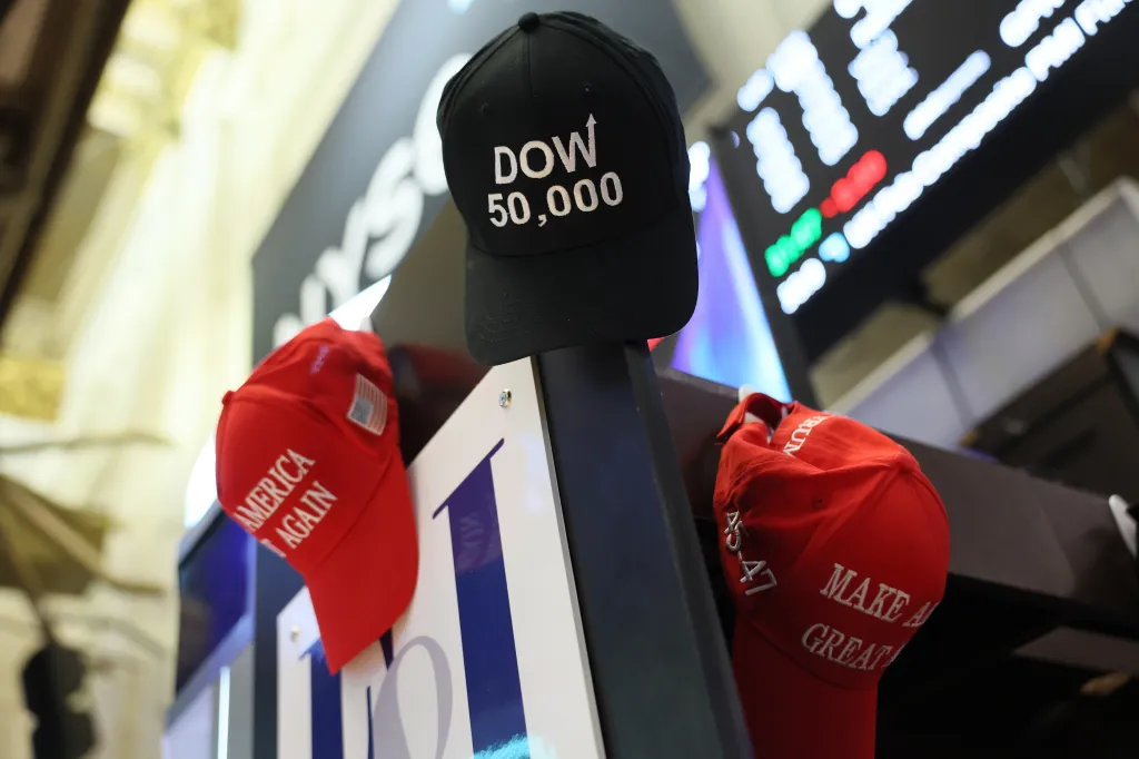 MAGA hats are hung on a wall as traders work on the floor of the New York Stock Exchange during morning trading on February 20th.