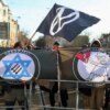 Demonstrators in Leipzig hold signs in protest of antisemitism.