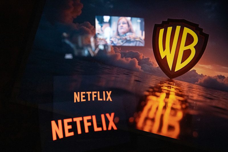 Multiple exposure photograph of the Netflix and Warner Bros logos in front of a television screen at Kerlouan in Brittany in France on December 05 2025. (Photo by Vincent Feuray / Hans Lucas / AFP via Getty Images)