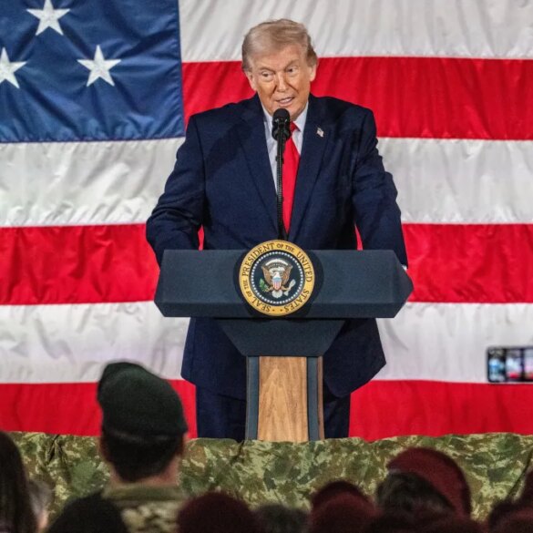Donald Trump speaking at a podium with the Seal of the President of the United States, in front of an American flag.