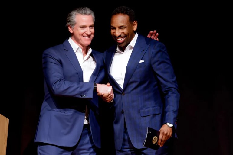 Mandatory Credit: Photo by ERIK S LESSER/EPA/Shutterstock (16692428q) Democratic California Governor Gavin Newsom (L) with Atlanta Mayor Andre Dickens (R) during his 'Young Man in a Hurry: A Memoir of Discovery' book tour stop in Atlanta, Georgia, USA, 22 February 2026. The autobiographical book will be released 24 February 2026. Gavin Newsom promotes 'Young Man in a Hurry: A Memoir of Discovery' book in Georgia, Atlanta, USA - 22 Feb 2026