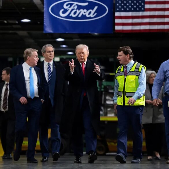 Donald Trump speaks with Bill Ford, Scott Bessent, Jim Farley, and Corey Williams at a Ford production center.