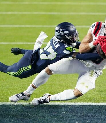 POLITICS: Patriots’ star wide receiver wears mask, handcuffs in Super