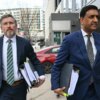 US Representatives Thomas Massie and Ro Khanna arriving at a Department of Justice office.