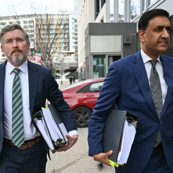 US Representatives Thomas Massie and Ro Khanna arriving at a Department of Justice office.