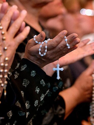 BAGHDAD, IRAQ - APRIL 7: Worshippers pray at a service for Pope John Paul II on April, 7, 2005 at a Catholic church in Baghdad, Iraq. Pope John Paul II died at his residence in the Vatican on April 2, aged 84 years old. His funeral will be held in St. Peter's Square on Friday, April 8. Cardinals under the age of 80 will start the conclave on April 18, where a new Pope will be chosen. (Photo by Wathiq Khuzaie/Getty Images)