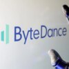 Illustration of the ByteDance logo next to a robotic hand.