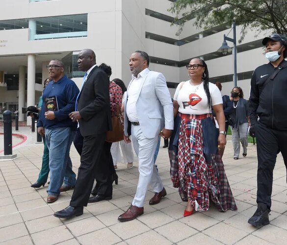Attorney Ben Crump, second from left, walks with Ron Lacks, left, Alfred Lacks Carter, third from left, both grandsons of Henrietta Lacks, and other descendants of Lacks, outside the federal courthouse in Baltimore in 2021. Novartis settled a lawsuit with the Lacks estate this month that alleged the pharmaceutical giant unjustly profited off her cells.