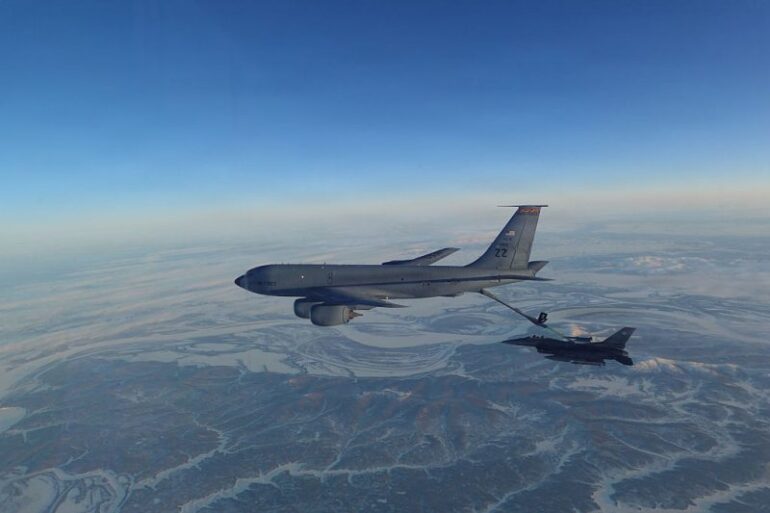 IN FLIGHT - ALASKA, UNITED STATES: (EDITOR’S NOTE: This Handout image was provided by a third-party organization and may not adhere to Getty Images’ editorial policy.) In this handout photo provided by the U.S. Department of War, a North American Aerospace Defense Command (NORAD) F-16 Fighting Falcon fighter refuels from a KC-135 Stratotanker over Western Alaska Feb. 19, 2026. NORAD employs a layered defense network of satellites, ground-based and airborne radars and fighter aircraft to detect and track aircraft and inform appropriate actions. NORAD remains ready to employ a number of response options in defense of North America and meeting presence with presence. (Handout Photo by U.S. Department of War/Getty Images)